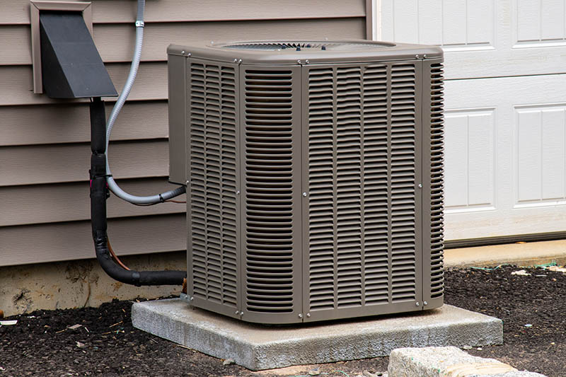 Air conditioning unit next to a house.