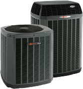Two outdoor Trane air conditioning units for residential cooling