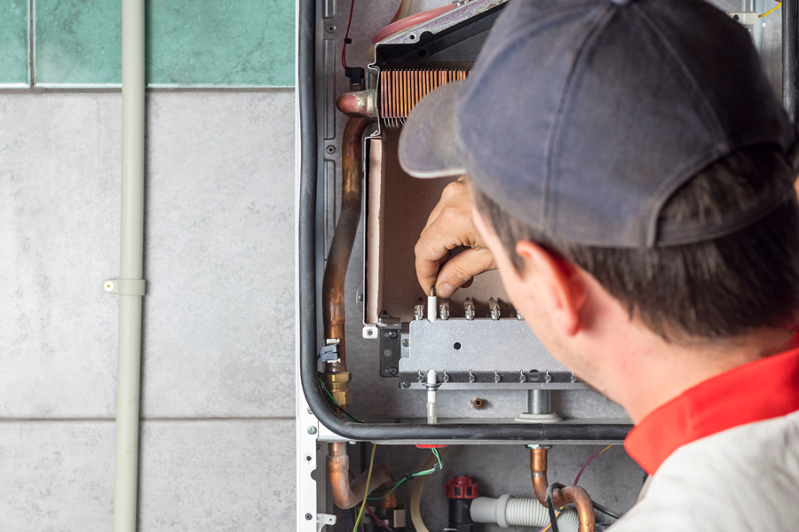 Technician working on a furnace.